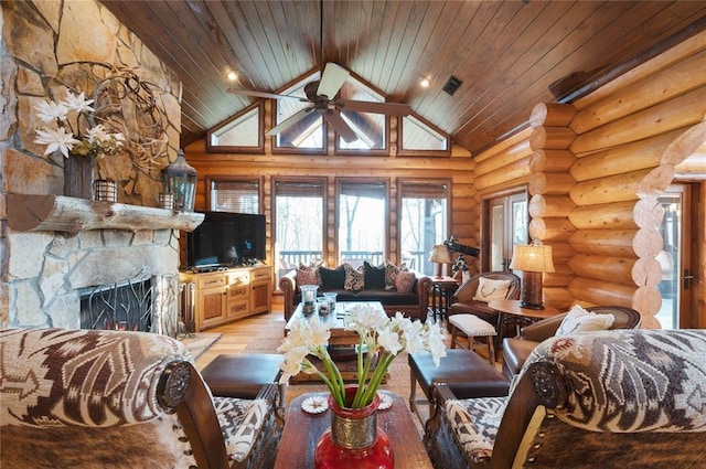 living room featuring ceiling fan, wooden ceiling, a stone fireplace, light hardwood / wood-style flooring, and high vaulted ceiling