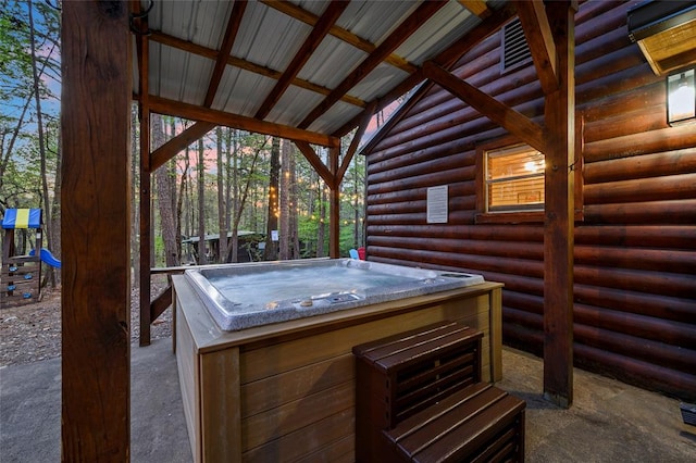 deck featuring a hot tub