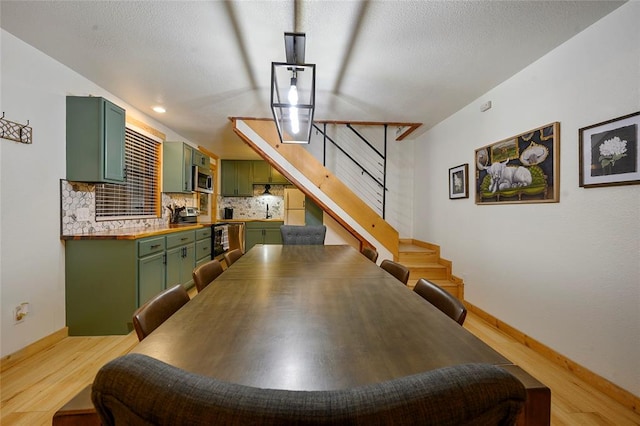 dining area with light hardwood / wood-style flooring