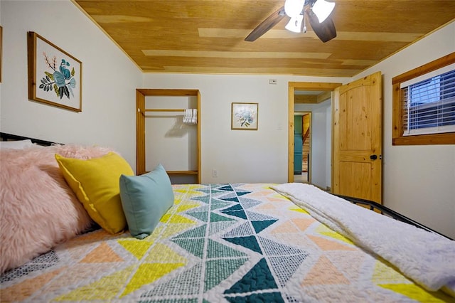 bedroom with ceiling fan, a closet, and wood ceiling