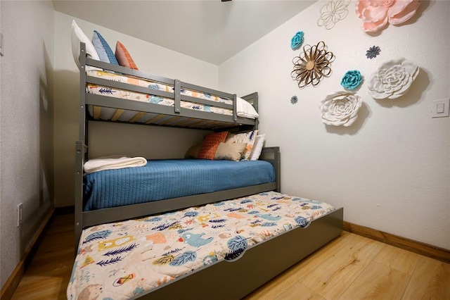 bedroom with wood-type flooring