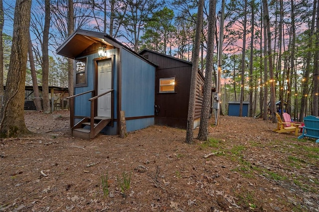 view of outdoor structure at dusk