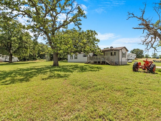 view of yard with a deck