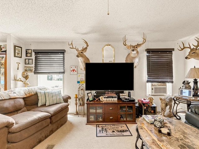 carpeted living room featuring a textured ceiling and cooling unit