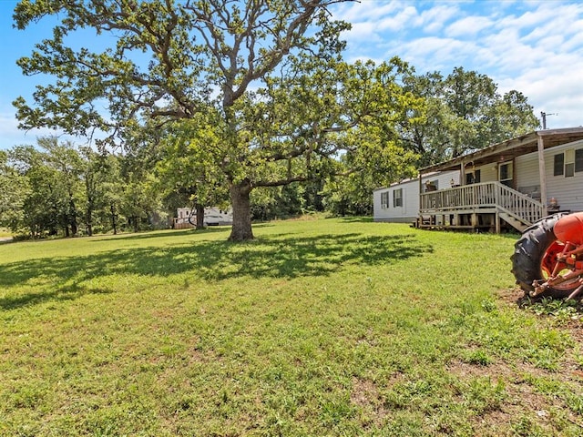 view of yard with a deck