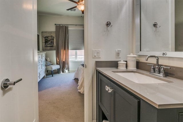 bathroom with ceiling fan and vanity