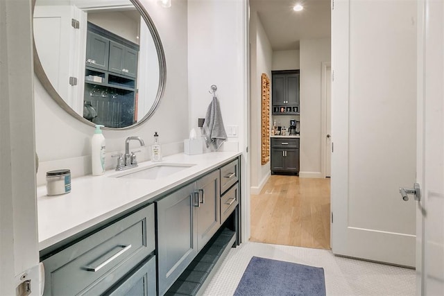 bathroom featuring vanity and wood-type flooring