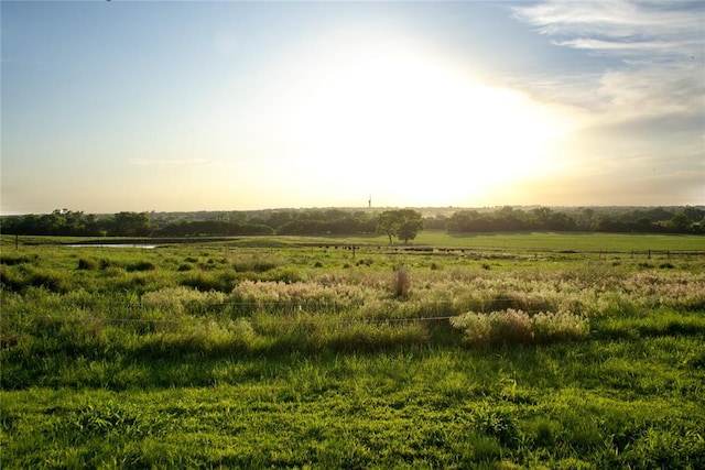 nature at dusk featuring a rural view