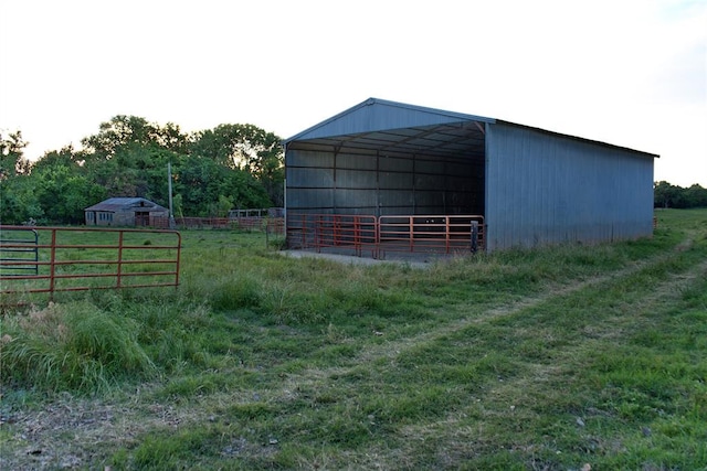 view of outdoor structure featuring a lawn