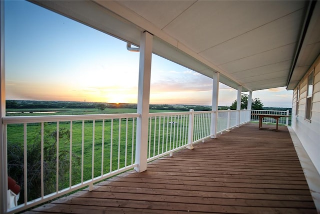 deck at dusk with a lawn