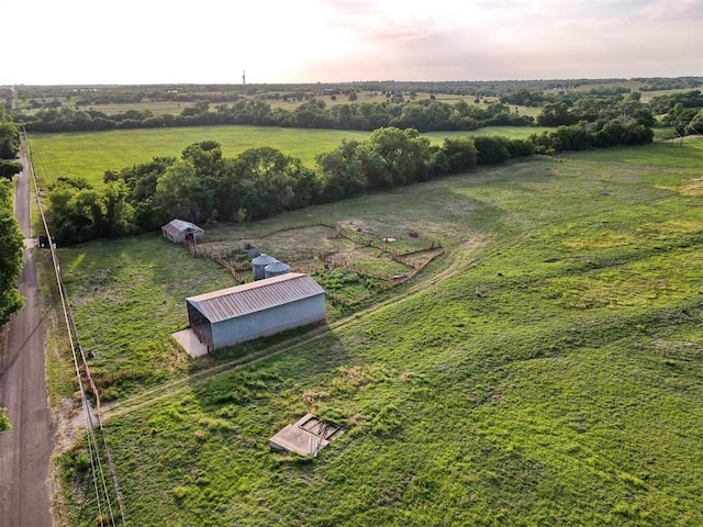 birds eye view of property featuring a rural view