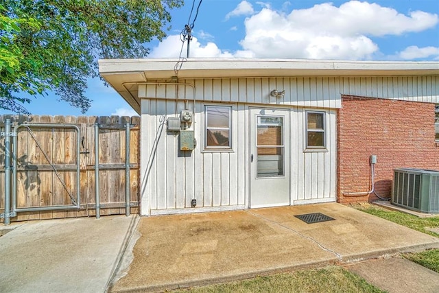 entrance to property featuring central AC and a patio area