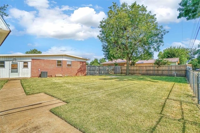 view of yard with central AC unit