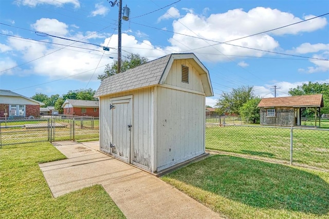 view of outbuilding with a lawn