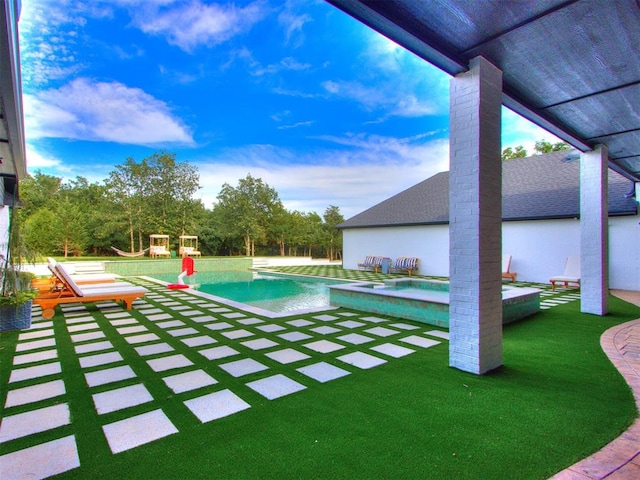 view of pool featuring a patio area and an in ground hot tub