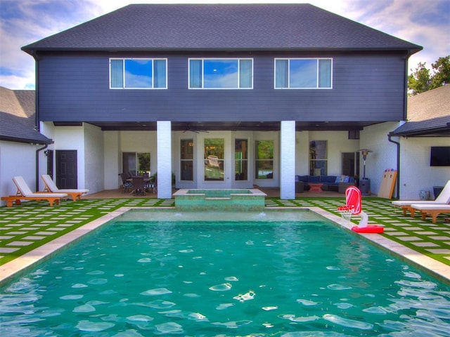 rear view of property with a patio area and ceiling fan