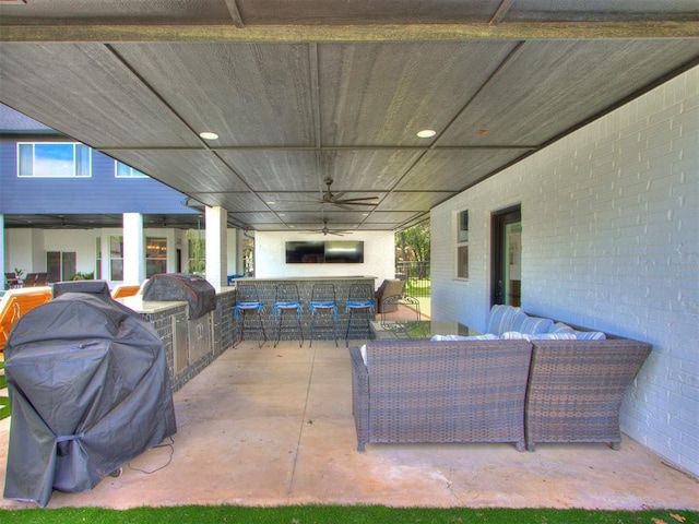 view of patio / terrace with an outdoor kitchen, an outdoor hangout area, and a grill