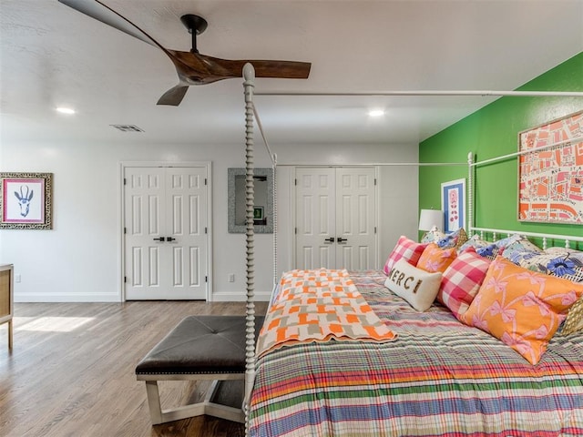 bedroom with ceiling fan and light hardwood / wood-style floors