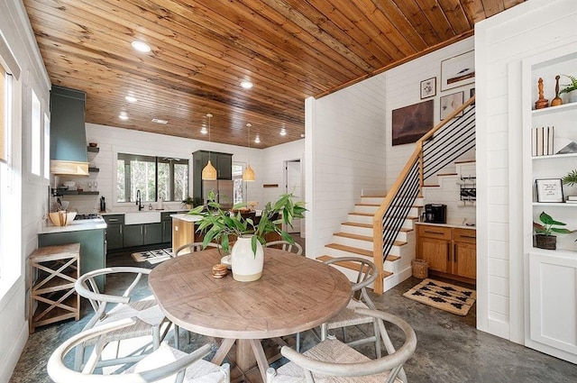 dining room with built in features, wooden ceiling, and sink