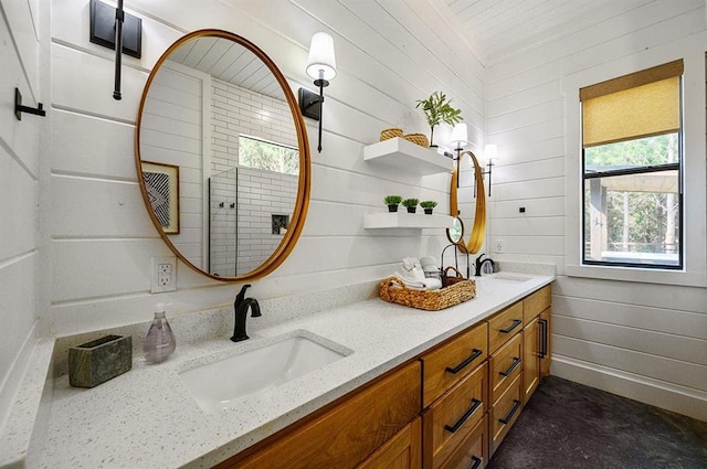 bathroom featuring vanity and wood walls