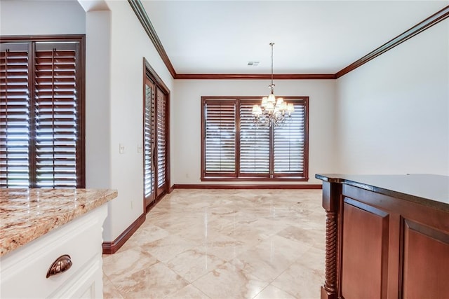 unfurnished dining area with a chandelier and ornamental molding