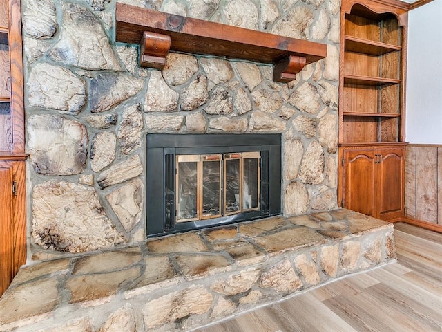 room details with a fireplace and hardwood / wood-style floors