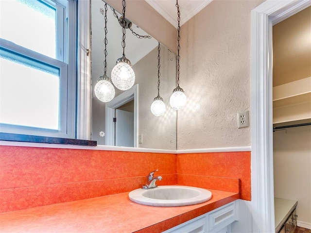 bathroom with vanity and crown molding