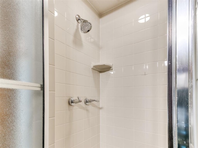 bathroom with a tile shower