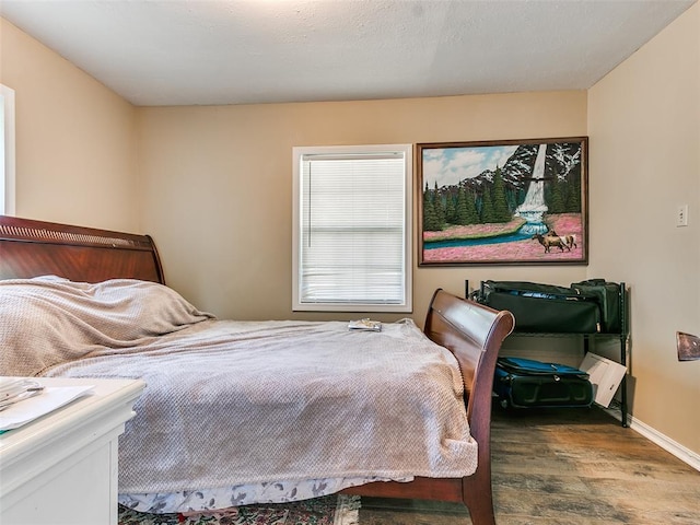 bedroom featuring hardwood / wood-style flooring