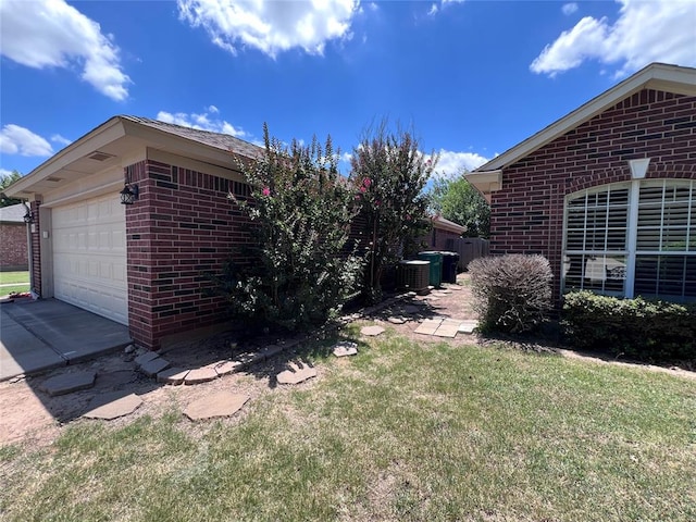 view of property exterior with a garage and a yard