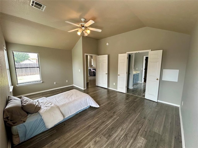 bedroom with dark hardwood / wood-style flooring, ceiling fan, and lofted ceiling