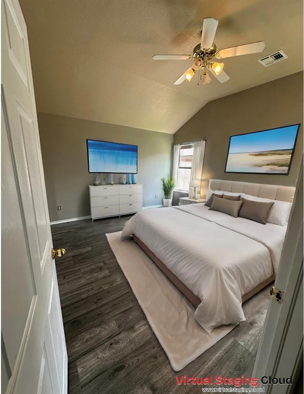 bedroom with ceiling fan, dark hardwood / wood-style flooring, and vaulted ceiling