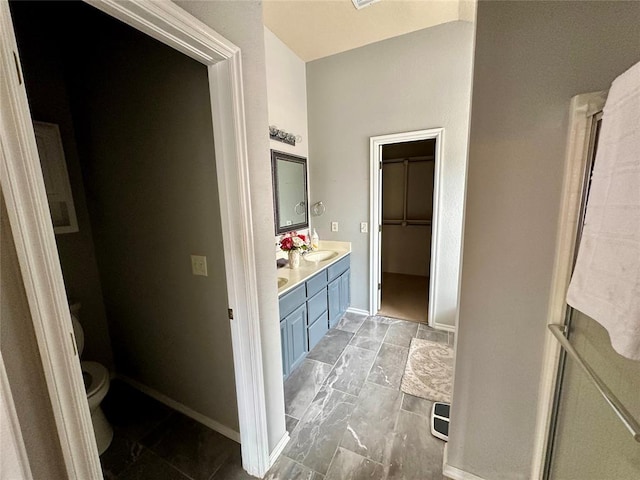 bathroom with vanity and toilet