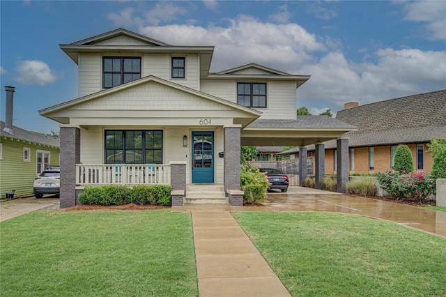 view of front facade with a front yard and a porch