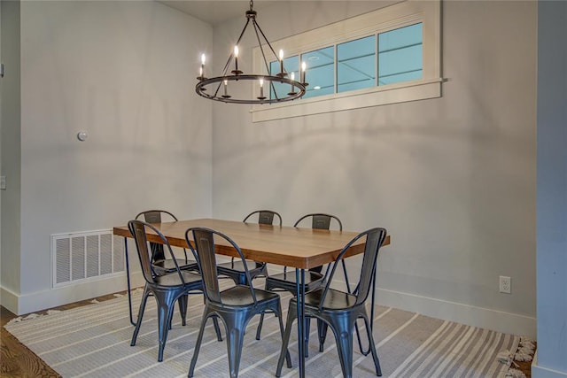 dining space featuring a notable chandelier