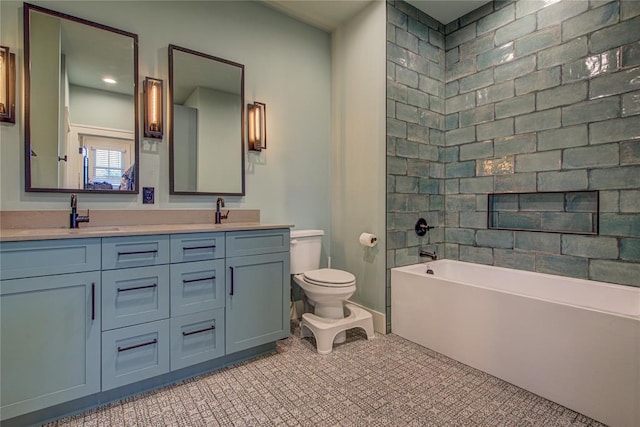 full bathroom with tile patterned floors, vanity, toilet, and tiled shower / bath