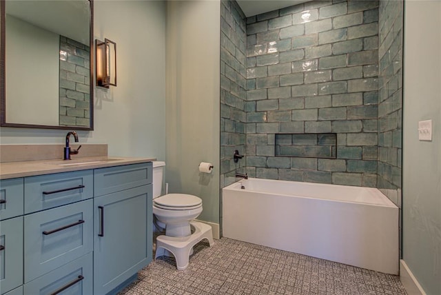 full bathroom with tile patterned flooring, vanity, toilet, and tiled shower / bath