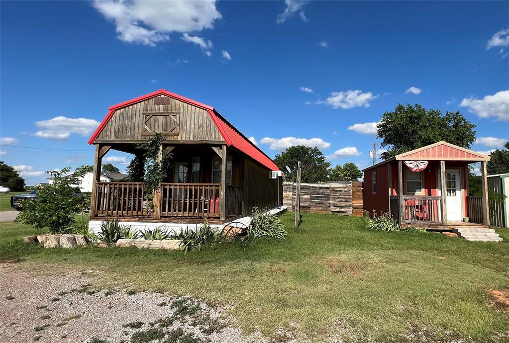 101 N Main St, Leedey, OK 73654 - exterior space with a yard and an outbuilding