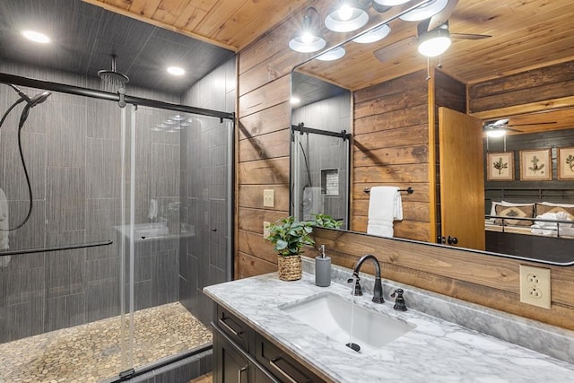 bathroom featuring vanity, wood walls, an enclosed shower, and wooden ceiling