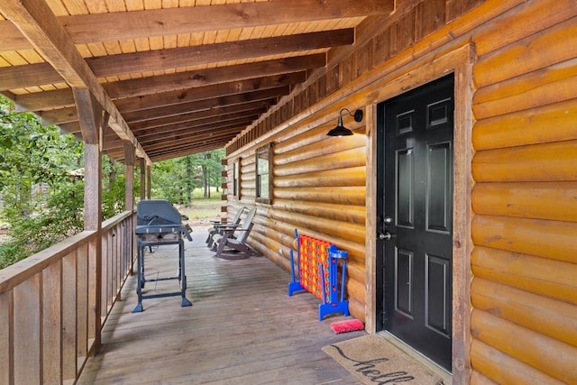 deck with covered porch and grilling area