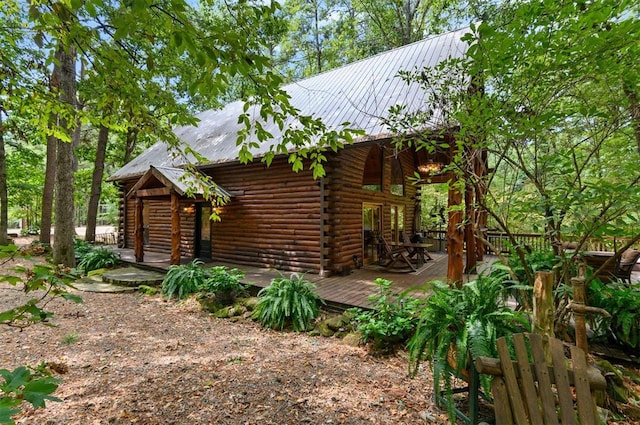 view of side of property with a deck