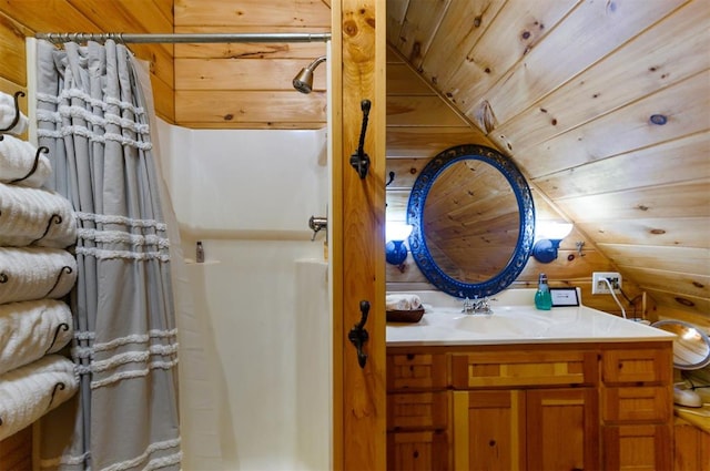 bathroom featuring vanity, vaulted ceiling, wooden ceiling, and wood walls