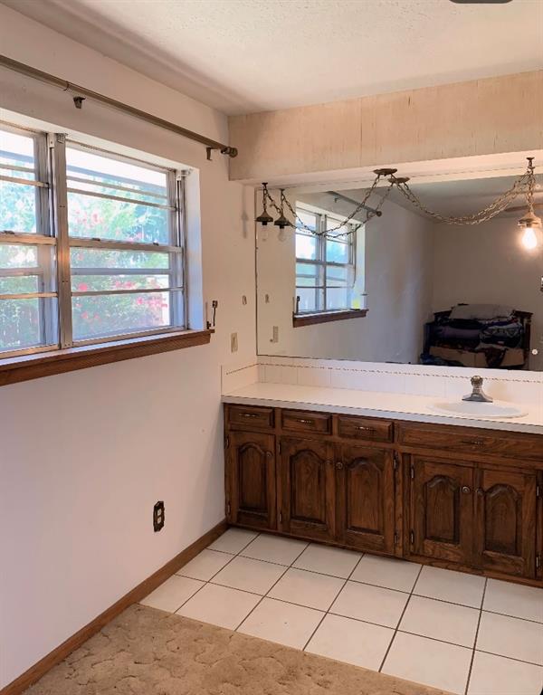 bathroom featuring tile patterned floors and sink