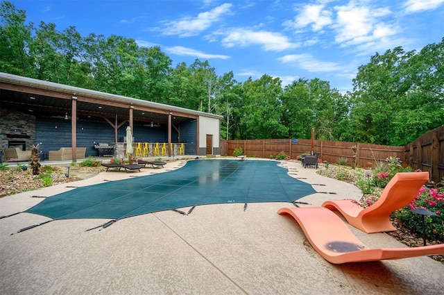 view of swimming pool with a patio