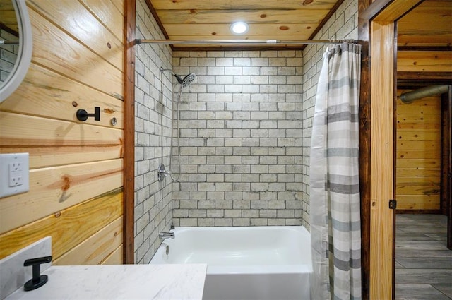 bathroom featuring shower / bath combo, wooden ceiling, and wood walls