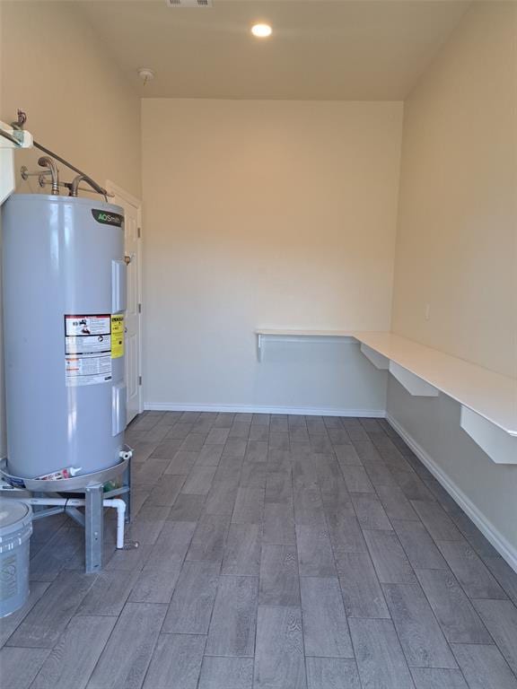 utility room featuring electric water heater