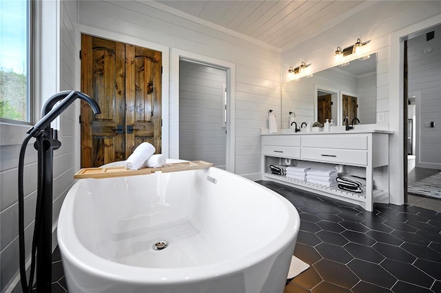 bathroom featuring wood ceiling, a tub to relax in, tile patterned floors, wood walls, and vanity