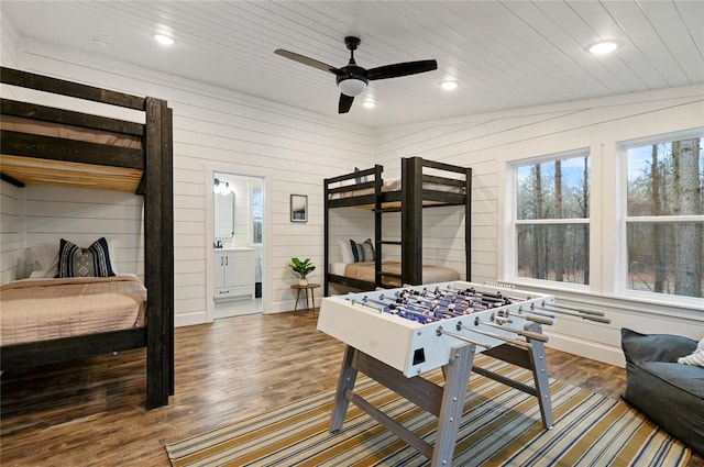 recreation room with dark hardwood / wood-style floors, ceiling fan, lofted ceiling, and wood ceiling