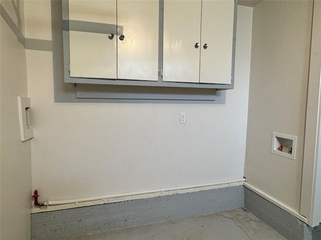 laundry area with hookup for a washing machine and cabinets