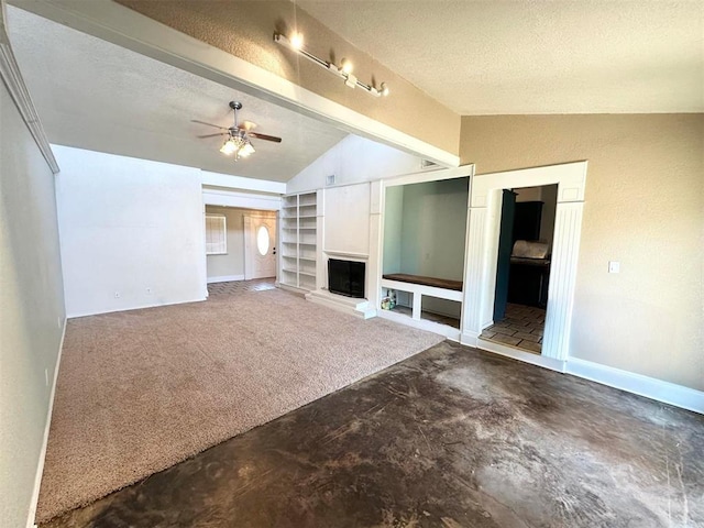 unfurnished living room featuring carpet, ceiling fan, a textured ceiling, and vaulted ceiling